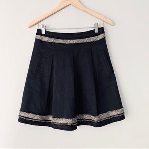 BCBG maxazaria pleated black skirt with tweed hem and chain